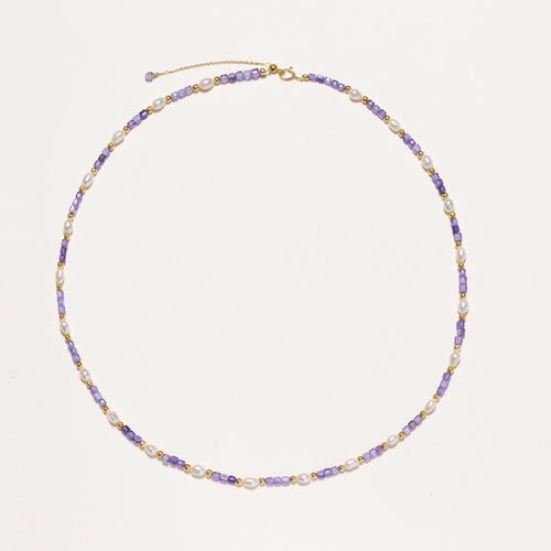 Close-up of lavender zirconia stones and freshwater pearls on gold vermeil necklace