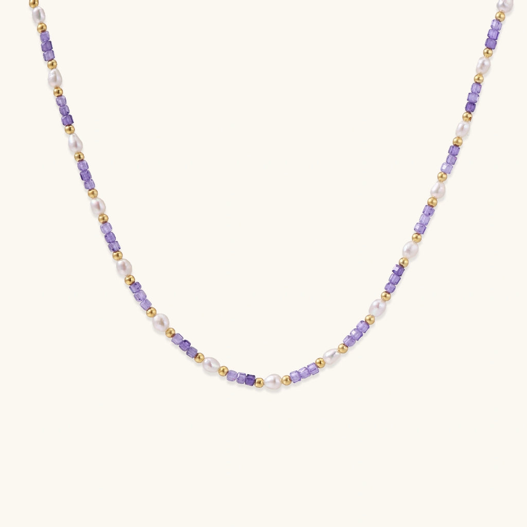 Detailed view of beaded necklace showing pearl and zirconia spacing
