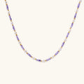 Detailed view of beaded necklace showing pearl and zirconia spacing