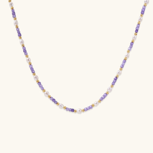 Detailed view of beaded necklace showing pearl and zirconia spacing