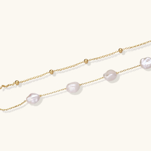 Close-up of baroque freshwater pearls on double gold vermeil chain bracelet