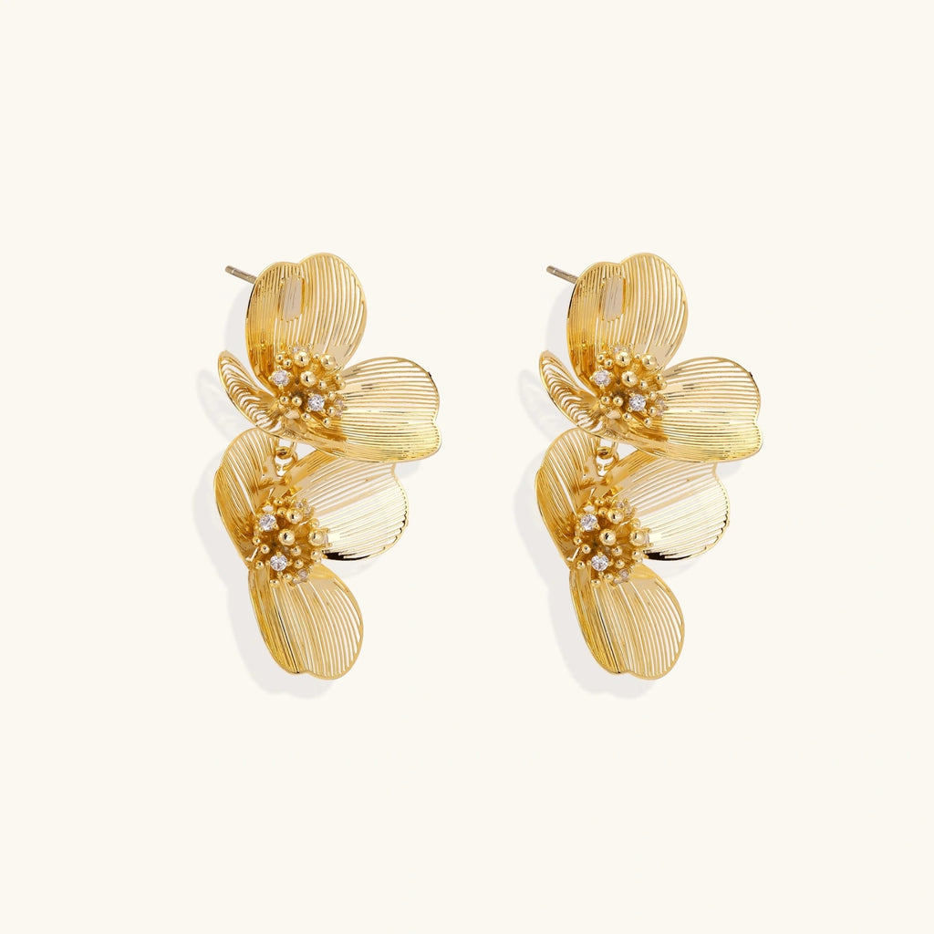 Side view of layered floral drop earrings showing dimensional structure