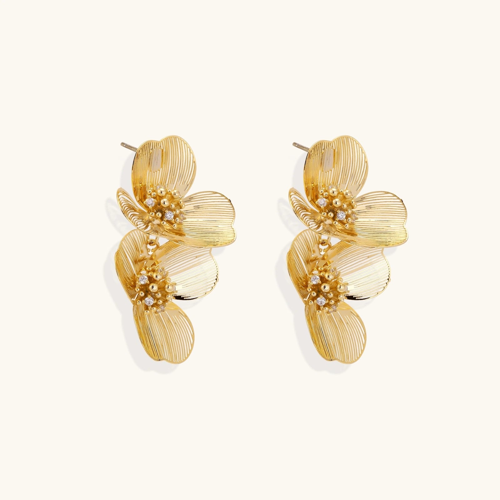 Side view of layered floral drop earrings showing dimensional structure