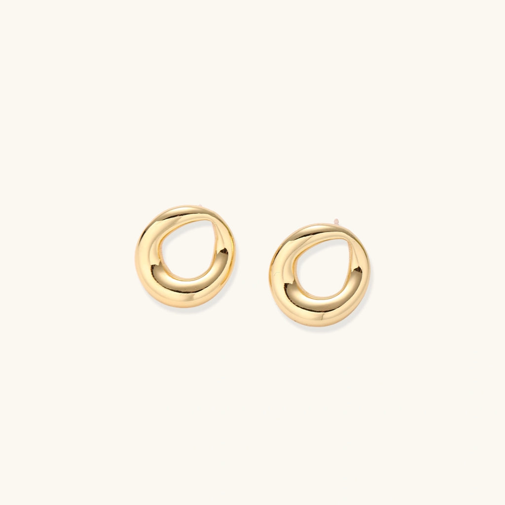 Front view of sculptural loop stud earrings with smooth gold finish