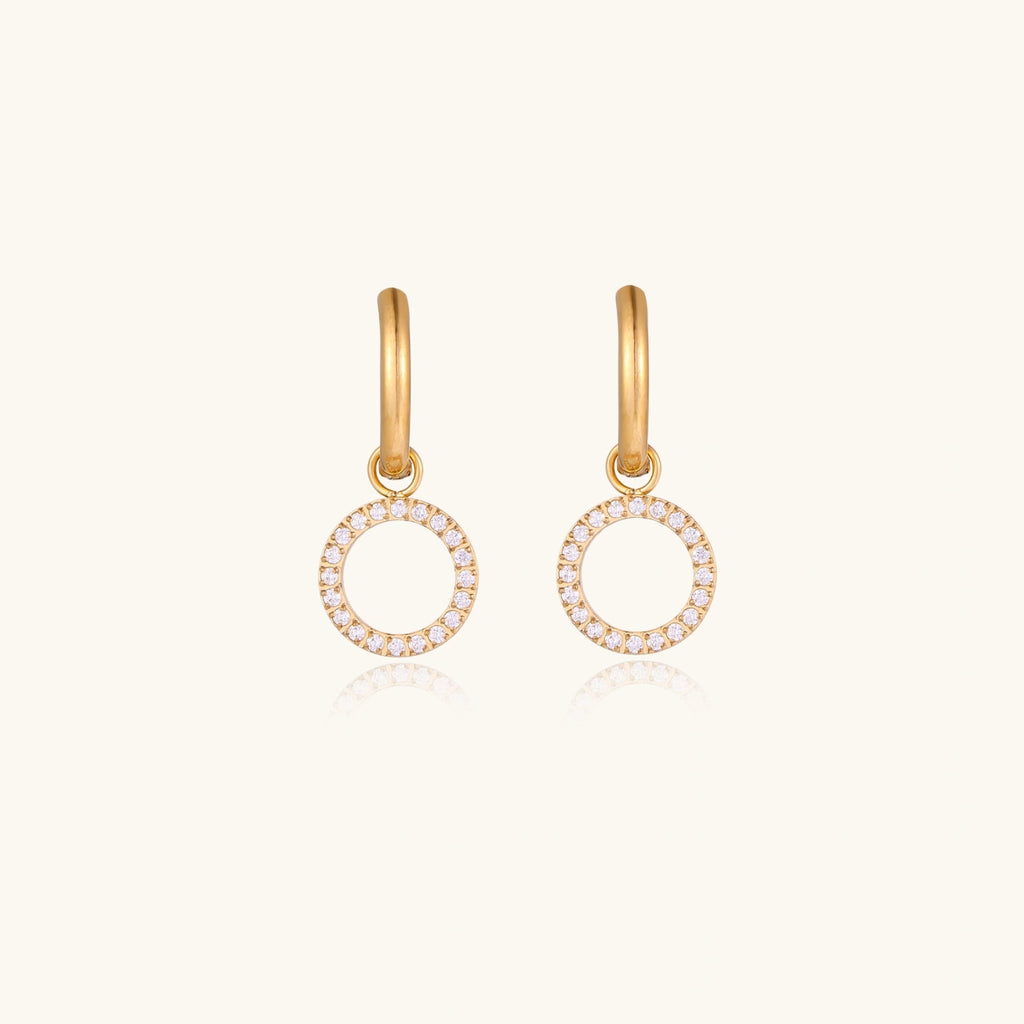 Front view of huggie hoop earrings with CZ circle charm