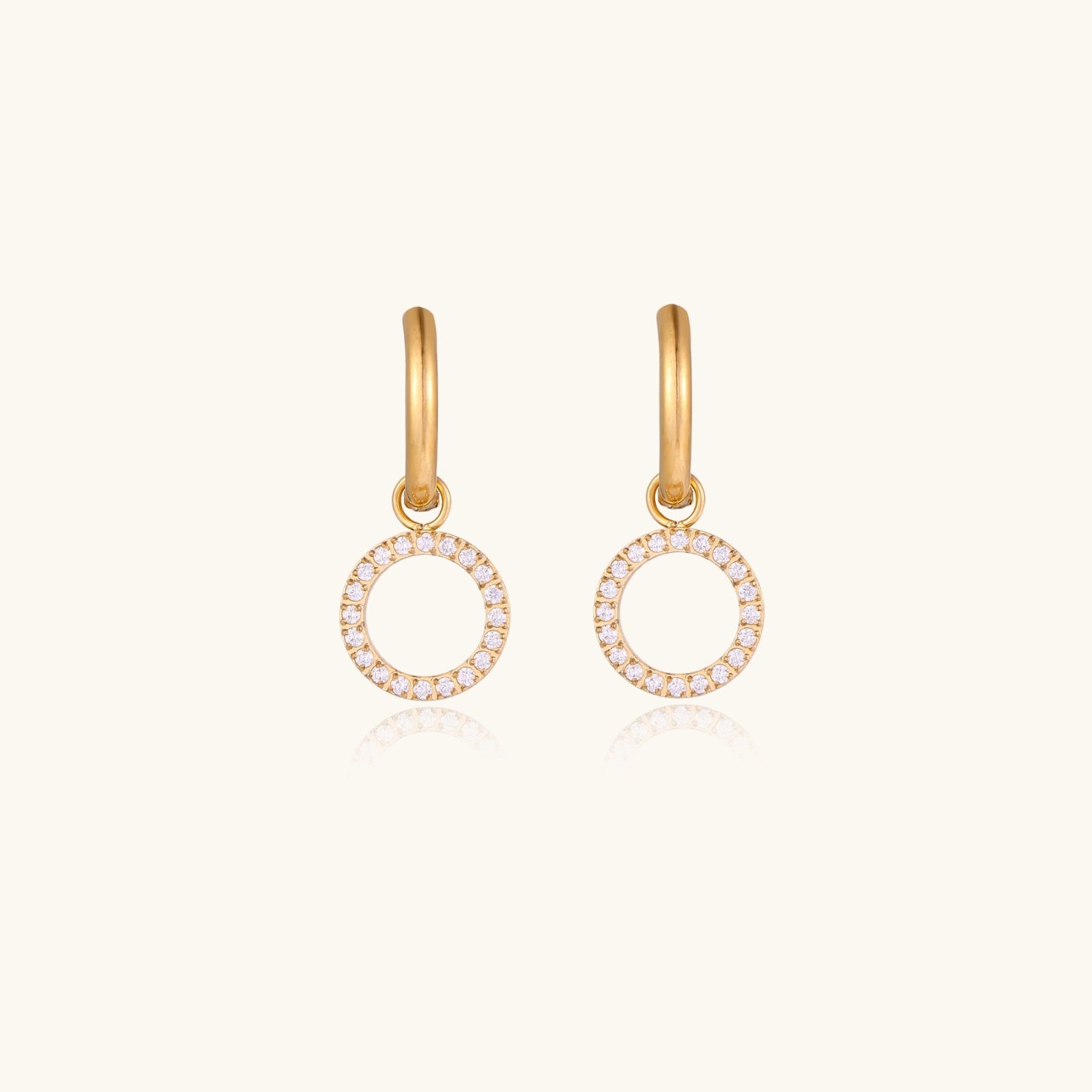 Front view of huggie hoop earrings with CZ circle charm