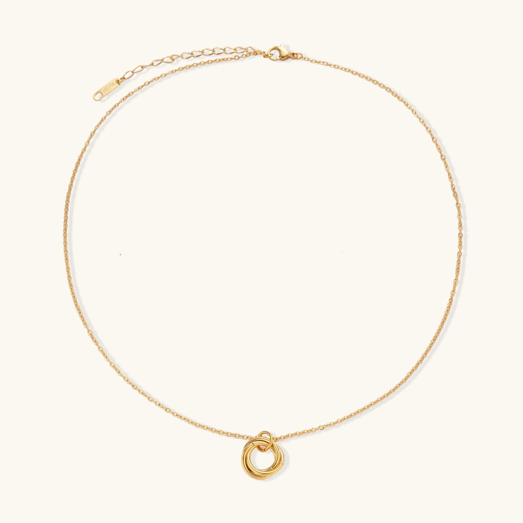 Front view of three interlocking circle pendant in gold plated stainless steel