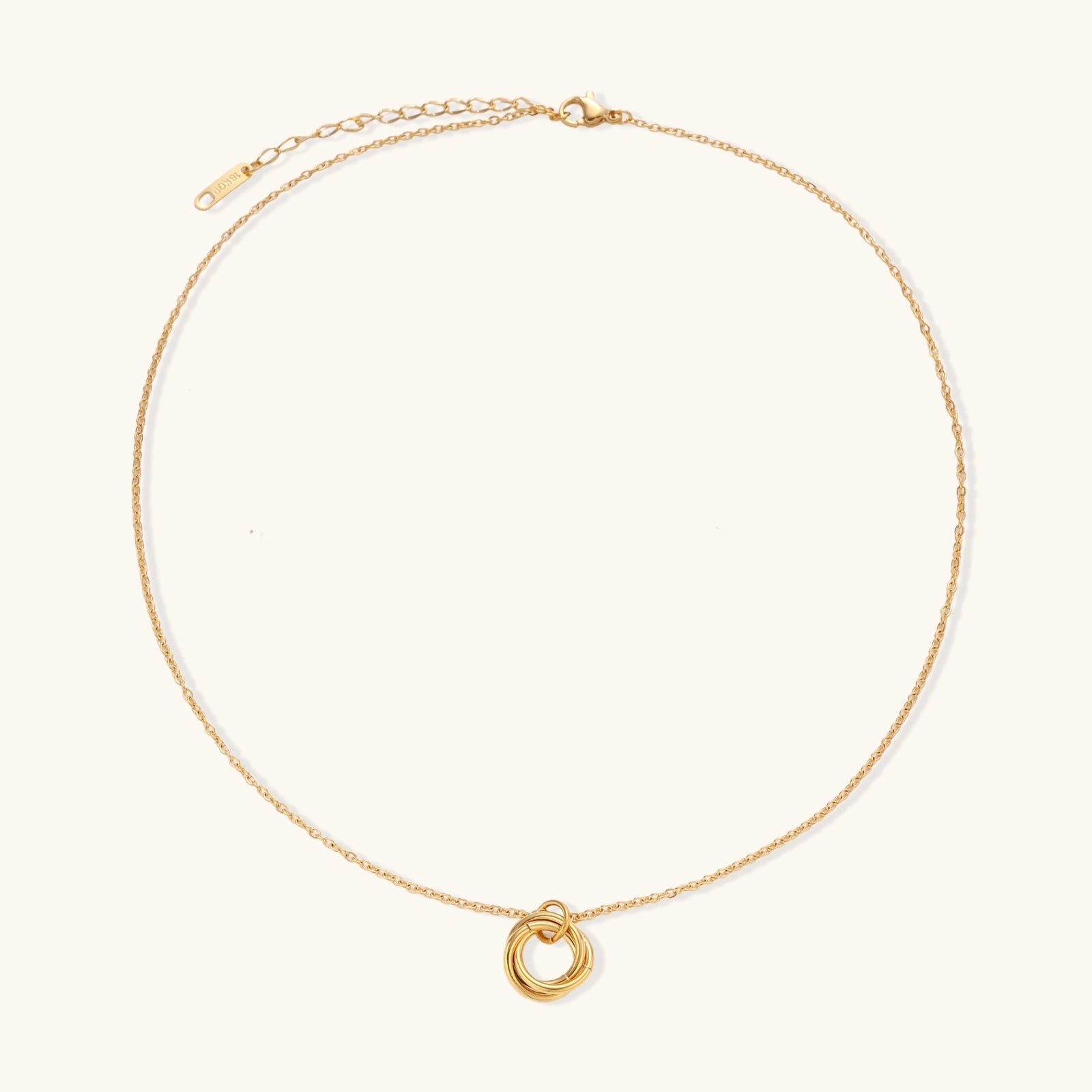 Front view of three interlocking circle pendant in gold plated stainless steel