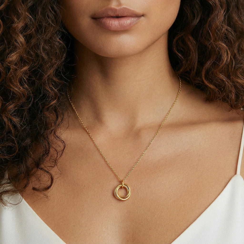 Model wearing GlacierFox Elements interlocking circles gold pendant necklace