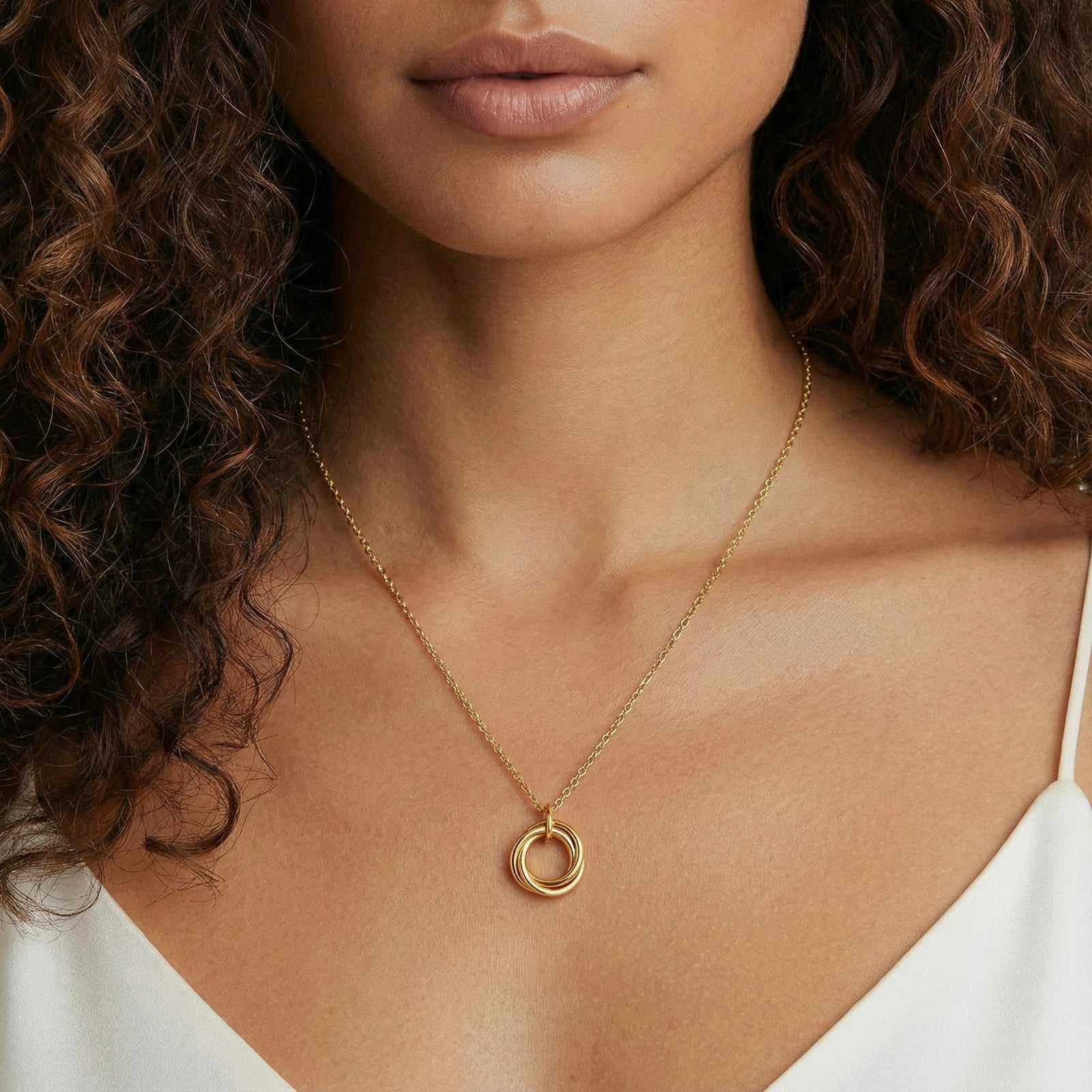 Model wearing GlacierFox Elements interlocking circles gold pendant necklace