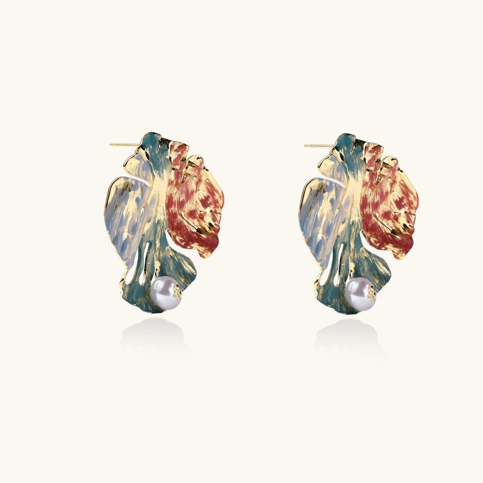 Side angle of monstera earrings highlighting dimension and shape