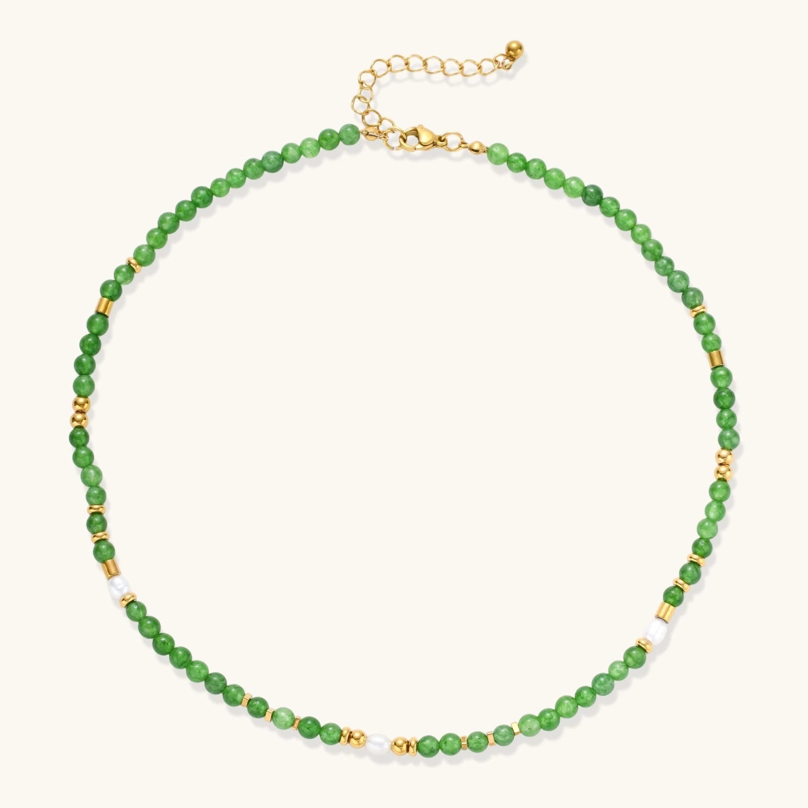 Front view of layered necklace with green stones and eye charm