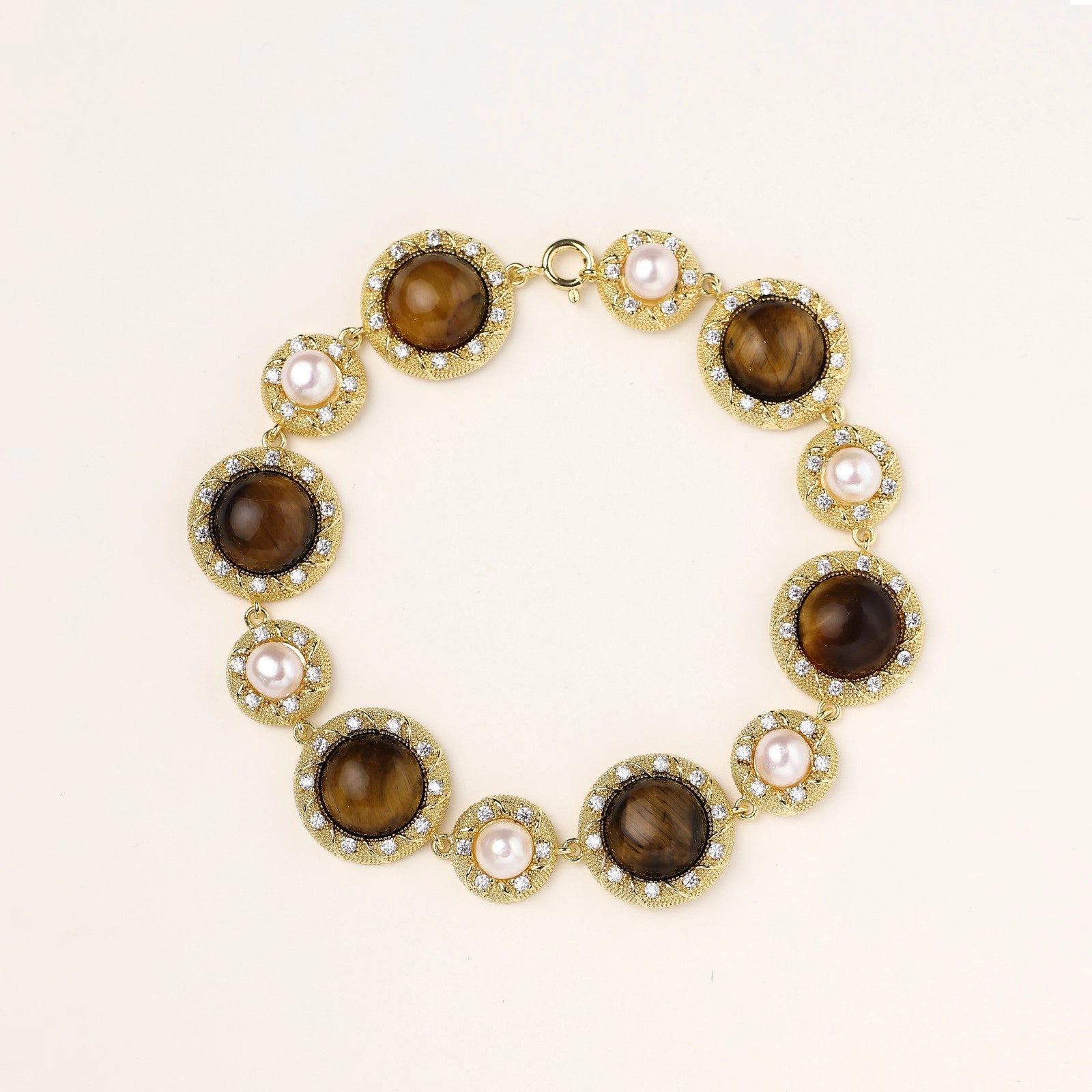 Front view of alternating tiger’s eye and pearl link bracelet