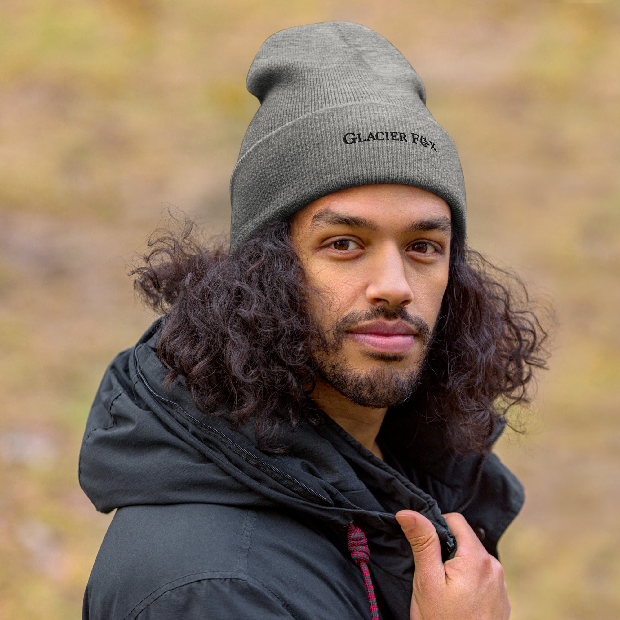 Model wearing GlacierFox Exclusive beanie with black embroidered logo and snug knit fit in Grey