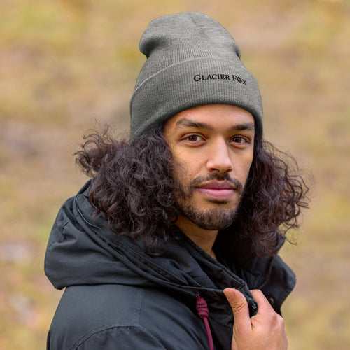 Model wearing GlacierFox Exclusive beanie with black embroidered logo and snug knit fit in Grey