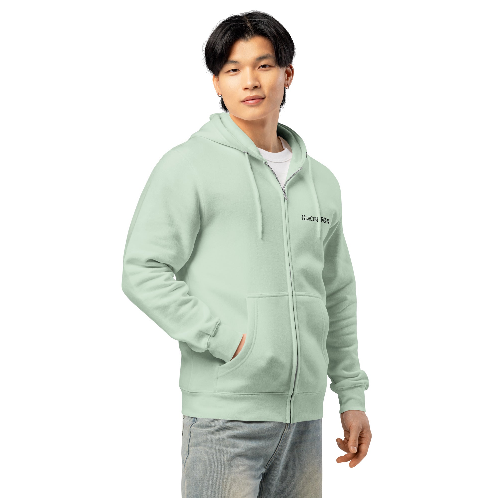 Side view of model wearing GlacierFox men’s zip hoodie with black embroidered logo and relaxed streetwear silhouette in Seafoam
