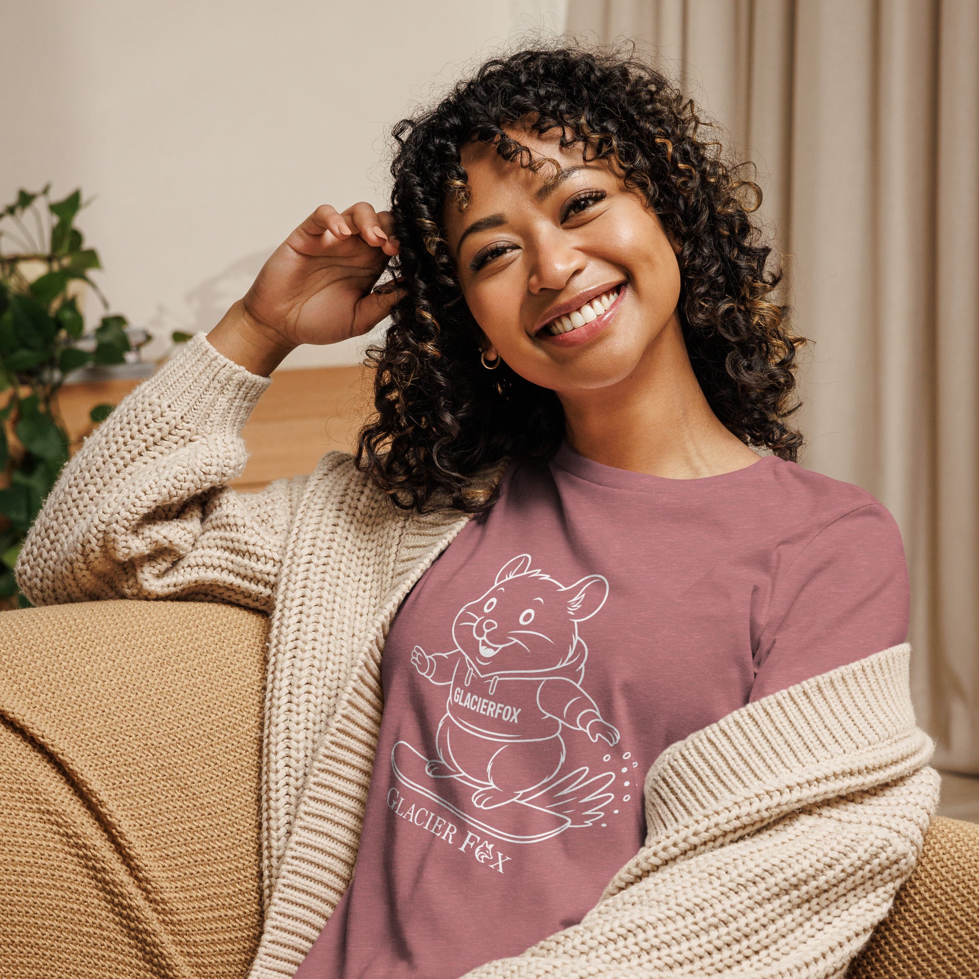 Model wearing GlacierFox Snowboarding Mr Cheeks women’s t-shirt featuring the Mr Cheeks hamster character design and relaxed modern streetwear fit in Heather Mauve