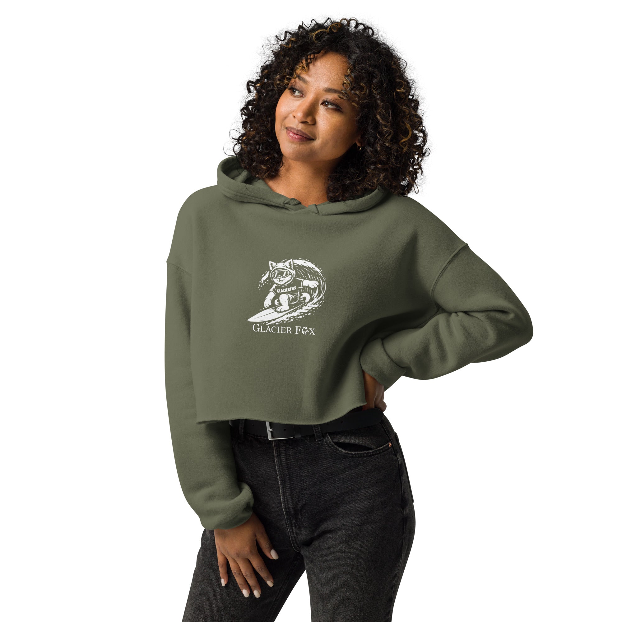 Model wearing GlacierFox Surfing Gilbert women’s crop hoodie featuring the Gilbert the GlacierFox character design, cropped streetwear fit, and raw hem in Military Green