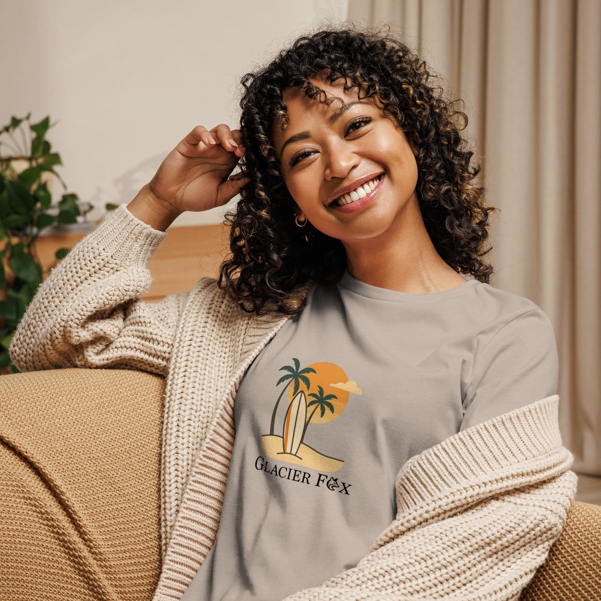 Model wearing GlacierFox women’s Beach t-shirt featuring a beach-inspired design with the GlacierFox logo on the front and relaxed streetwear fit in Heather Stone