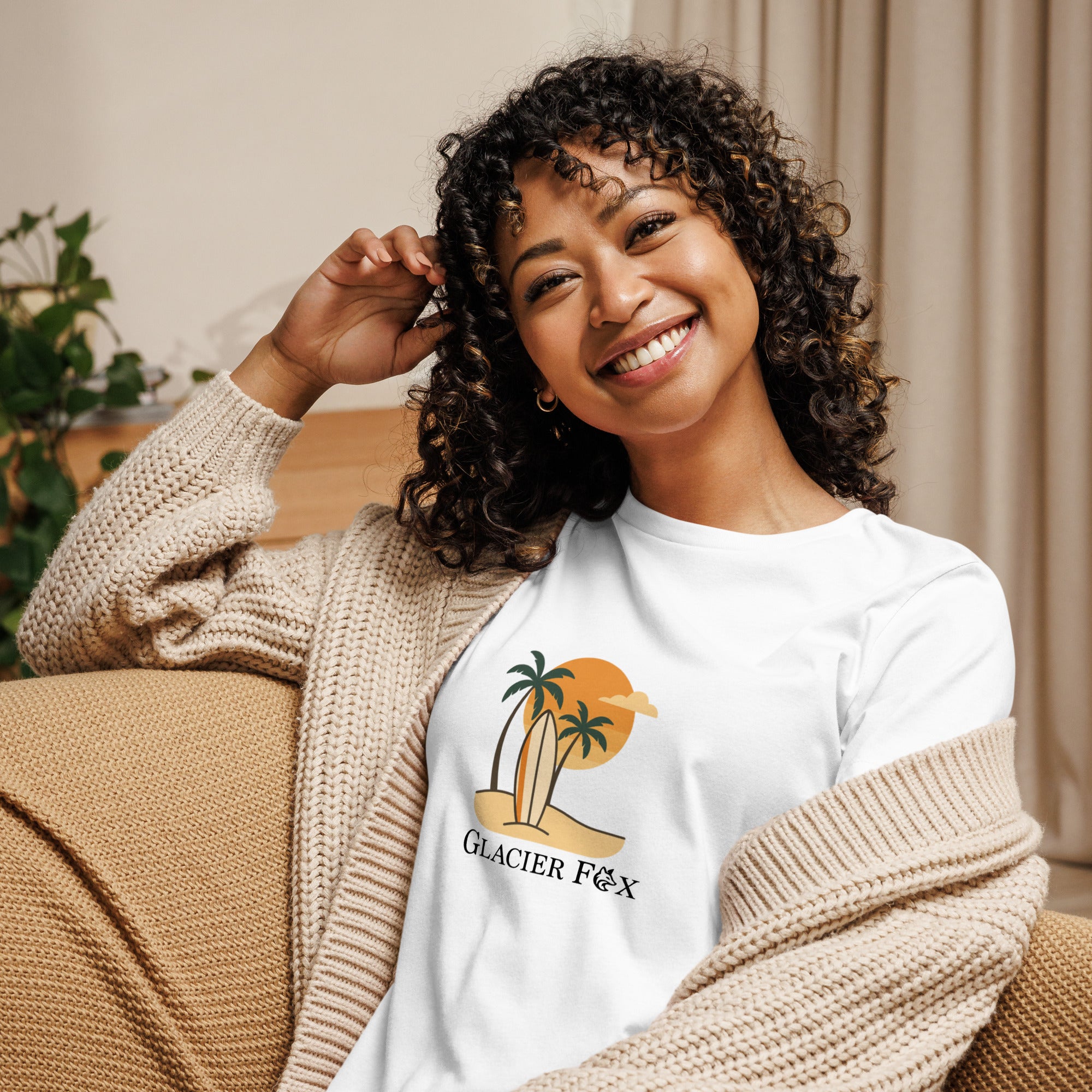 Model wearing GlacierFox women’s Beach t-shirt featuring a beach-inspired design with the GlacierFox logo on the front and relaxed streetwear fit in White