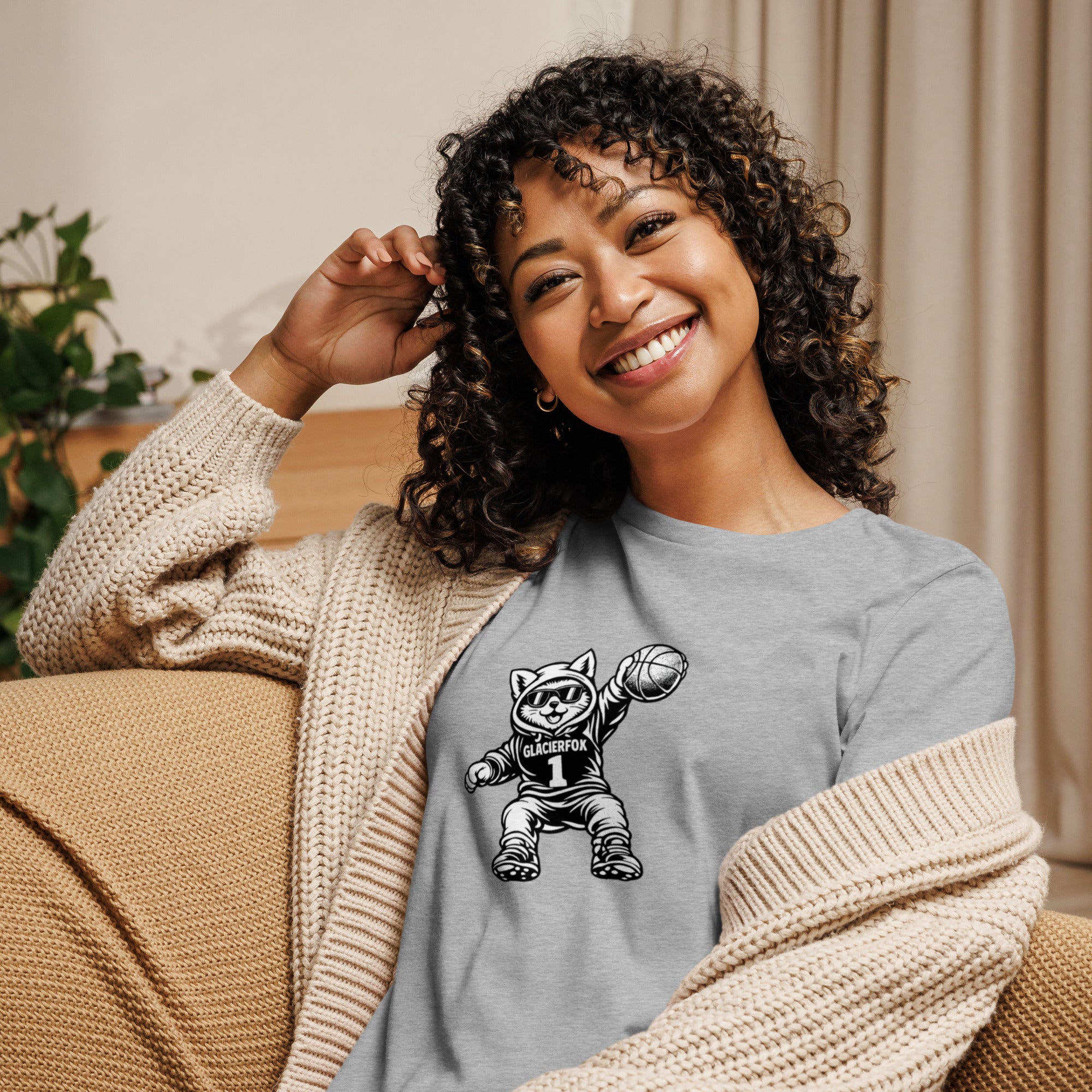 Model wearing GlacierFox women’s Gilbert Slam Dunk t-shirt featuring the Gilbert basketball character graphic on the front in Athletic Heather