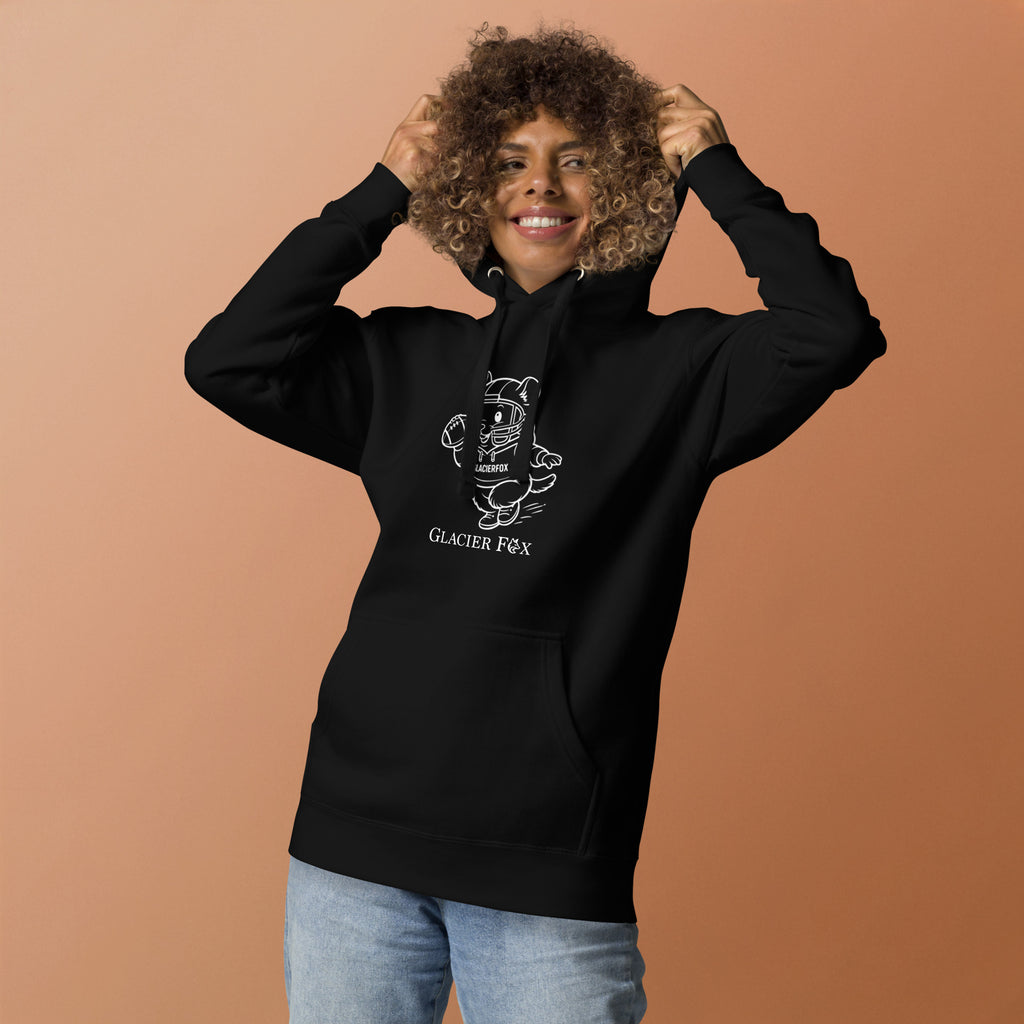 Model wearing GlacierFox women’s Mr Cheeks quarterback hoodie featuring the Mr Cheeks character graphic on the front and relaxed streetwear fit in Black